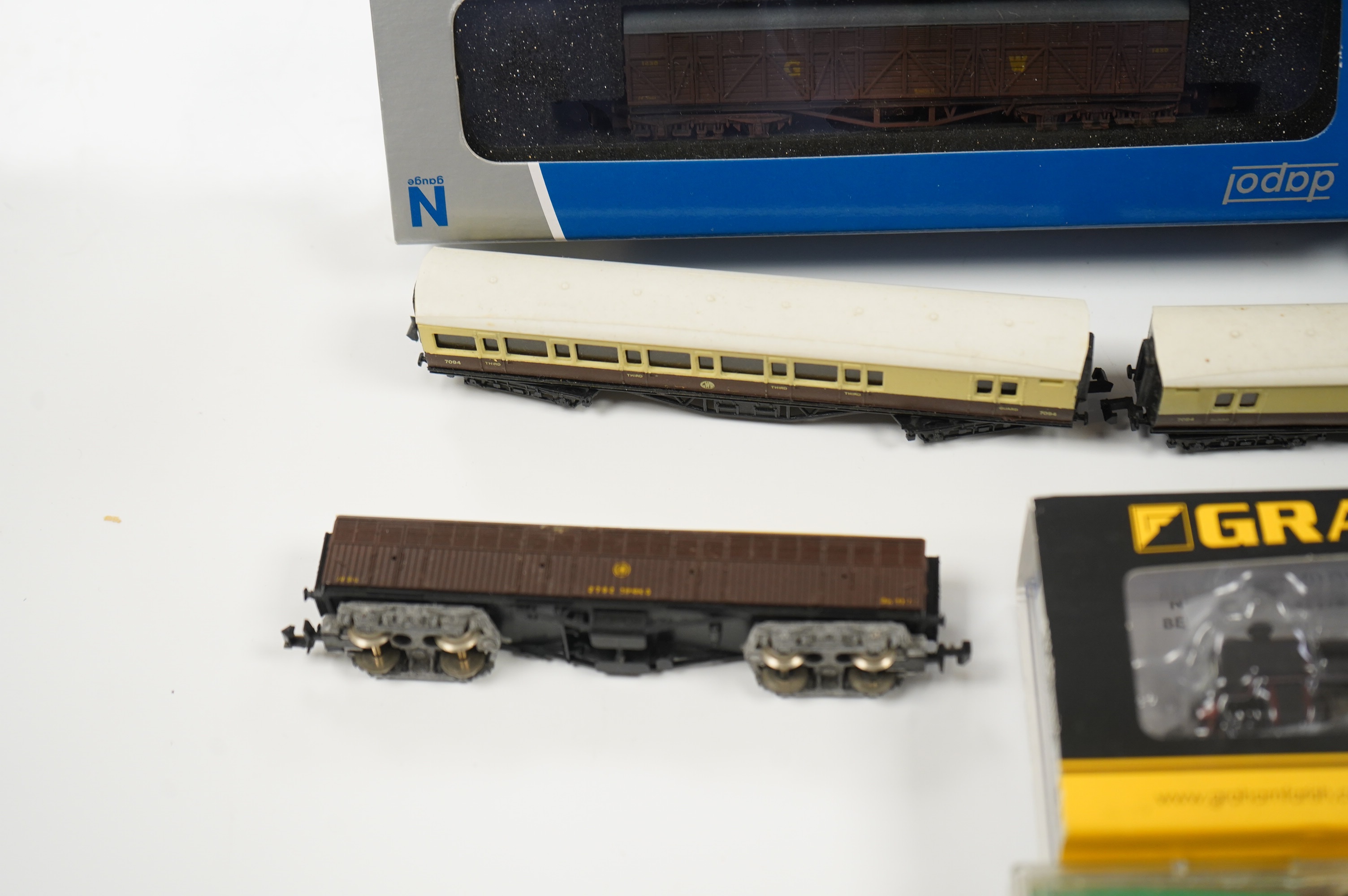 Eleven N gauge railway items by Dapol and Graham Farish; a BR N Class 2-6-0 locomotive, 31844, six GWR bogie coaches, two Siphon H wagons and two Siphon G wagons. Condition - good, five items boxed.